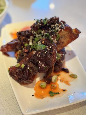 Brass Kitchen and Bar signature dishes Spinach and Arugula SaladPork CheeksKorean Short Ribs